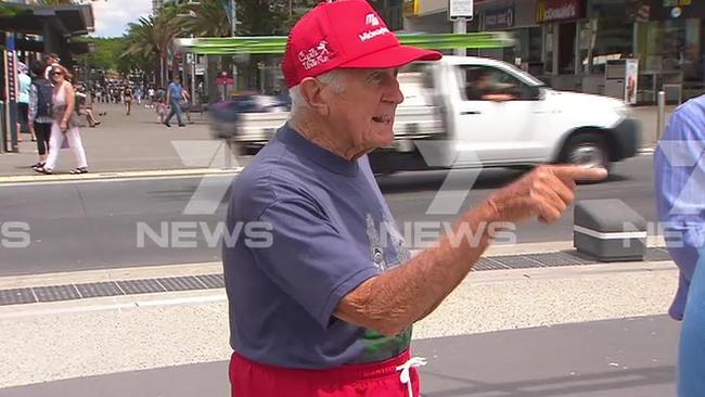 The man gatecrashers the press conference. Pic: 7 News.