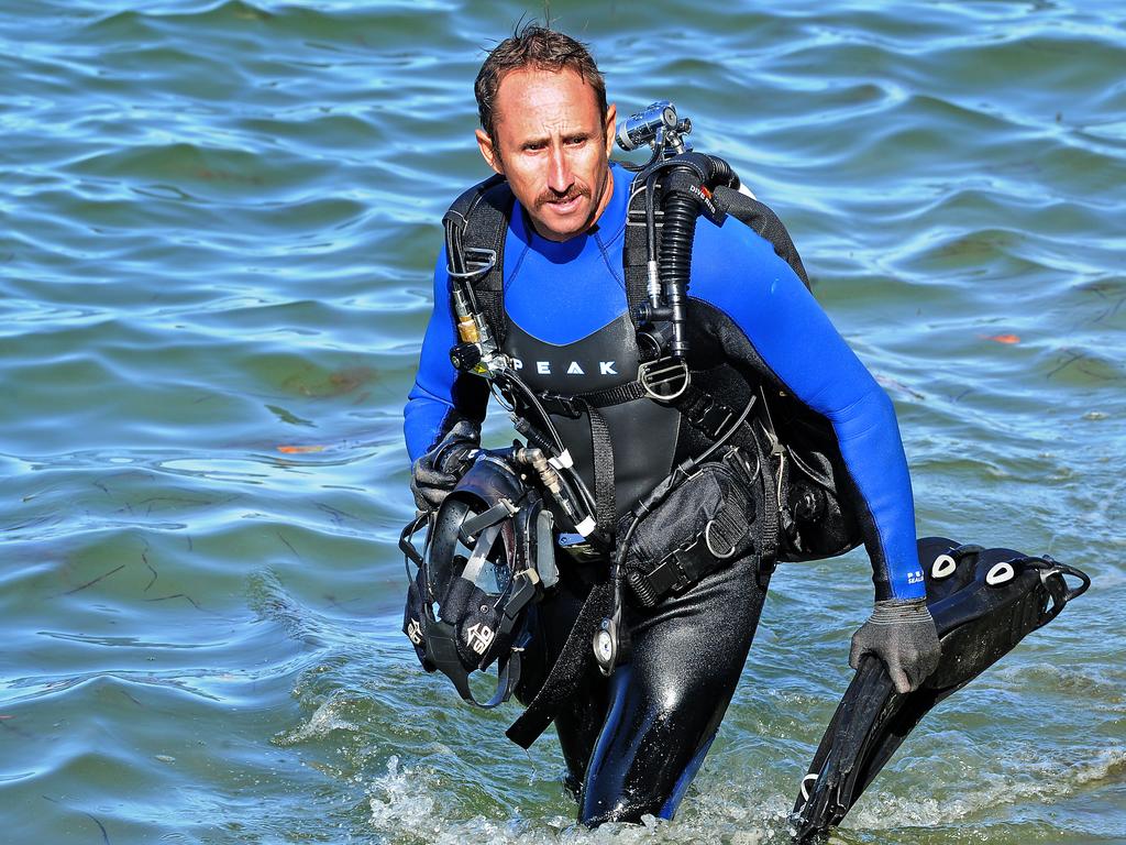 One of the police divers looking for evidence at Jack Evans boat harbour. Picture: AAP image, John Gass.