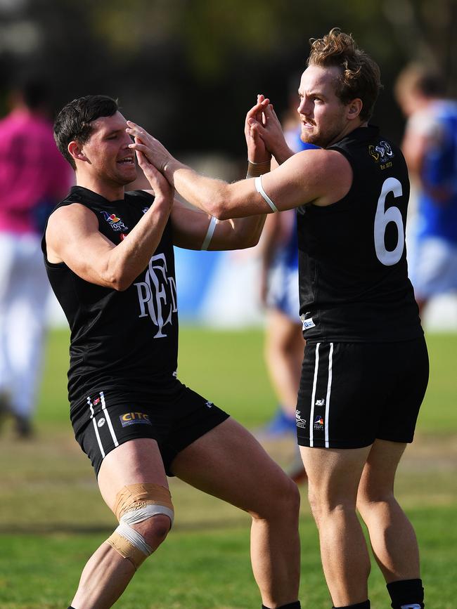 James Batty (right) celebrates a goal for Port District. Picture: AAP/Mark Brake