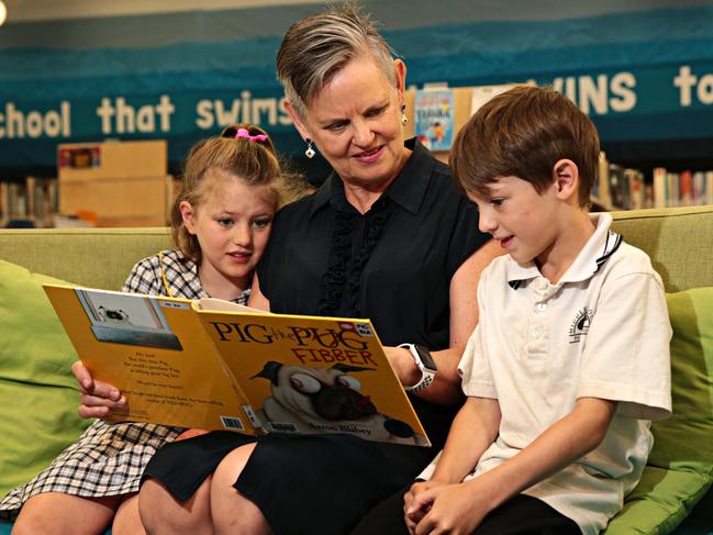 Reading about the adventures of Pig the pug. Picture: AAP IMAGE / Adam Yip