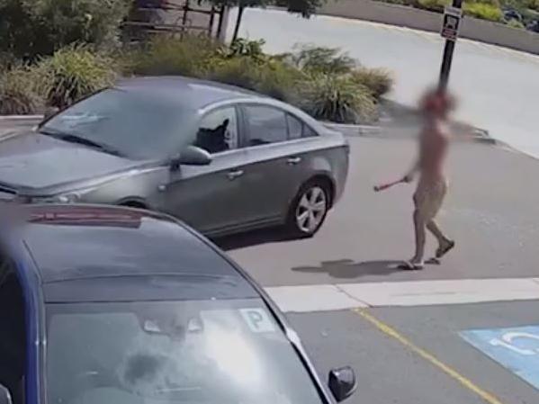 Footage captured Warren (wearing a red cap, face blurred) taking a baseball bat to the elderly man's car, shattering a window.