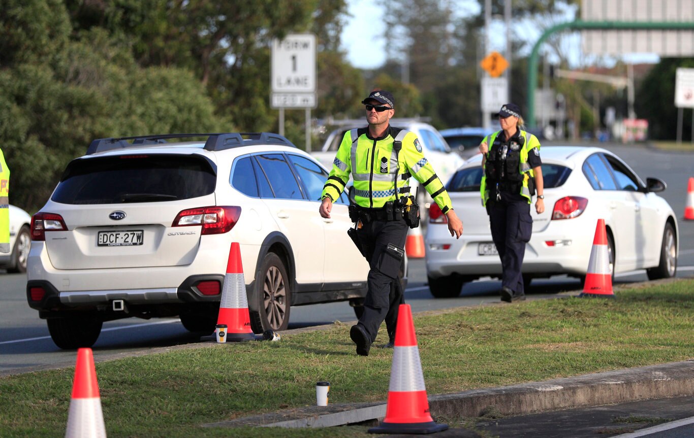 Queensland Police set up a road block due to the Corona Virus at the NSW / Queensland Border on the old Pacific Highway at Coolangatta. Photo: Scott Powick Newscorp