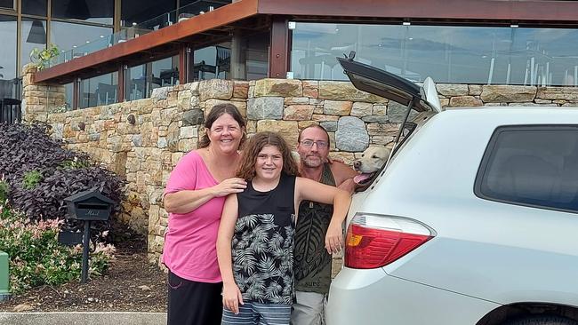 Louise Dwyer with her partner Mike and son Phoenix as they pack up and leave the Ocean Shore evacuation centre, in search for a permanent home.