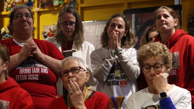 Friends of Israeli hostage Yair Horn watch the release. Picture: Ahmad Gharabli / AFP