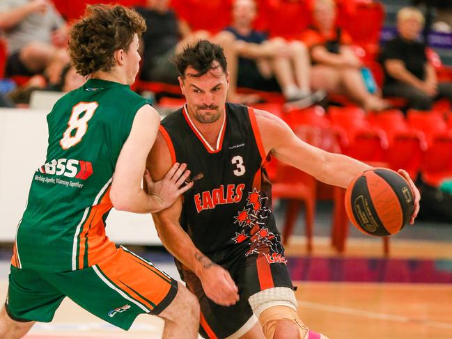 Ambros Eugster drives for the basket against the Razzle/Cannons. Picture: Glenn Campbell.