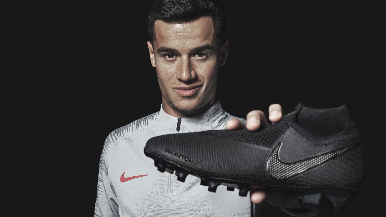 Philippe Coutinho holds the new Nike PhantomVSN boot