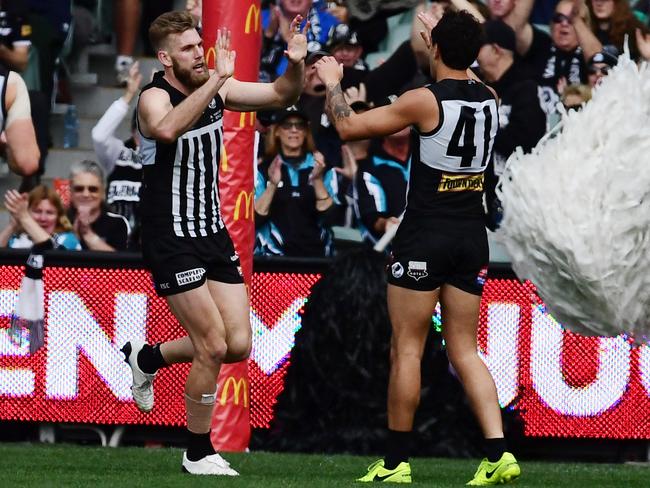 Port's Jackson Trengove celebrates kicking a goal with Brendon Ah Chee. Picture: TOM HUNTLEY