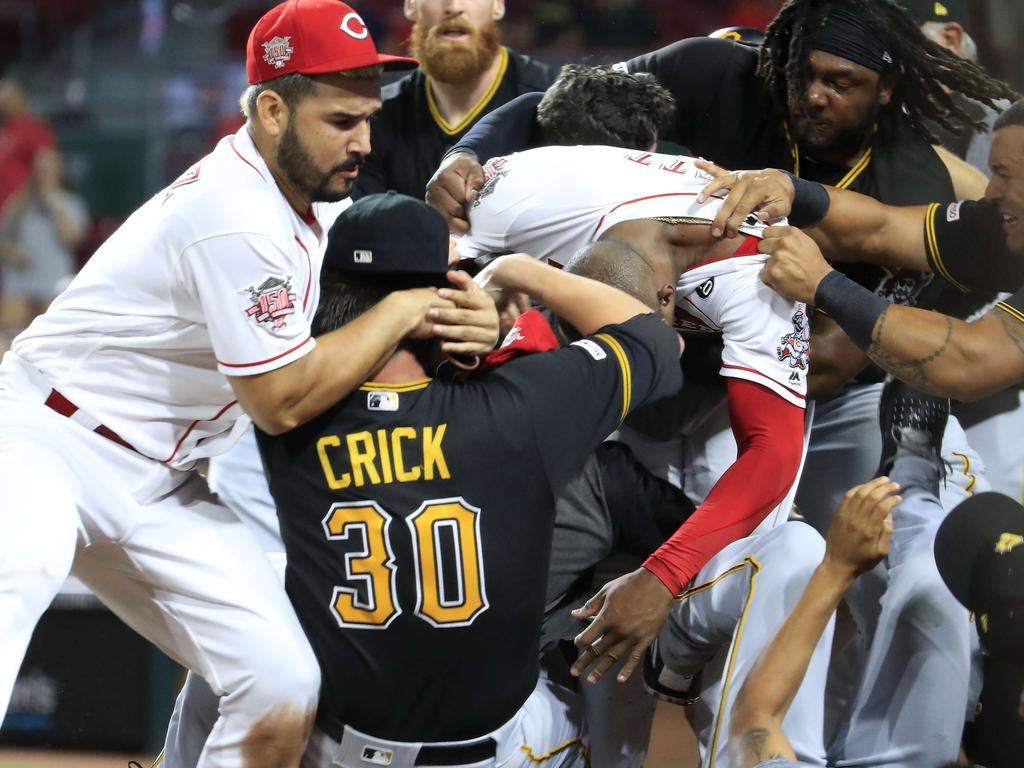 CINCINNATI, OHIO - JULY 30: Amir Garrett #50 (middle white shirt with out hat) of the Cincinnati Reds engages members of the Pittsburgh Pirates during a bench clearing altercation in the 9th inning of the game at Great American Ball Park on July 30, 2019 in Cincinnati, Ohio.   Andy Lyons/Getty Images/AFP == FOR NEWSPAPERS, INTERNET, TELCOS & TELEVISION USE ONLY ==