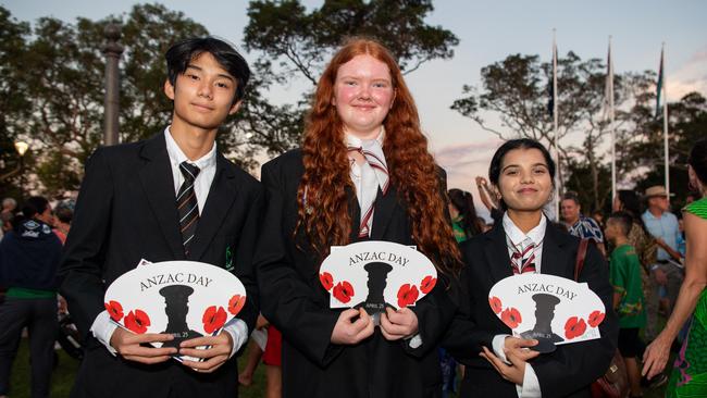 Pak Chan, Hanna Eastick and Drashti Patel as Territorians gather in Darwin City to reflect on Anzac Day. Picture: Pema Tamang Pakhrin