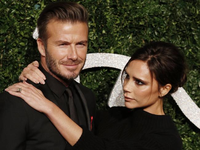 David Beckham and Victoria Beckham on the red carpet at the British Fashion Awards, 2014.