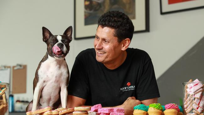 Jason Blachowski with Boston terrier Poppi at Woof Gateaux Boutique Pet Bakery, in Enmore. Picture: Justin Lloyd