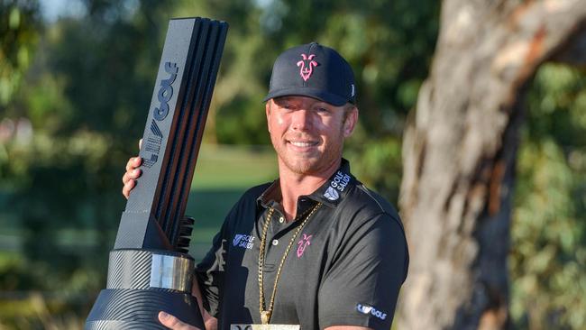 Talor Gooch of the US poses with the trophy after winning the 2023 LIV Golf tournament in Adelaide. (Photo by Brenton Edwards / AFP)