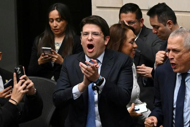 Thirty-nine-year-old Senator Miguel Uribe (C) was speaking to supporters in the west of the capital when a gunman shot him