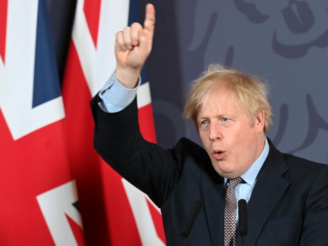 TOPSHOT - Britain's Prime Minister Boris Johnson gestures as he holds a remote press conference to update the nation on the post-Brexit trade agreement, inside 10 Downing Street in central London on December 24, 2020. - Britain said on Thursday, December 24, 2020 an agreement had been secured on the country's future relationship with the European Union, after last-gasp talks just days before a cliff-edge deadline. (Photo by Paul GROVER / POOL / AFP)