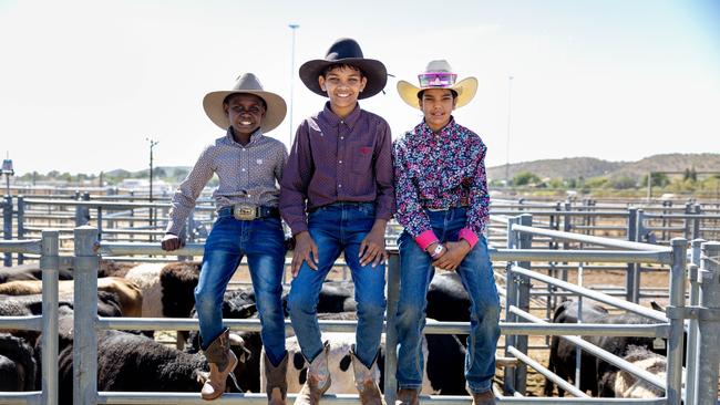 Mount Isa Rodeo 2024 - Warren Webb, 9, Joshua Ah-One, 11, and Lareece Daley, 11, aheaed of the Mount Isa Rodeo. Picture by Luke Marsden.