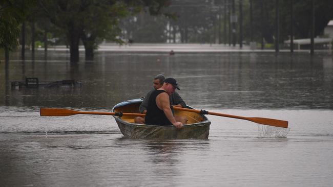 Miles St on Sunday. Floodwaters have inundated much of Ingham, Hinchinbrook Shire, after the Herbert River breached its banks, compounding surface flooding from days of monsoonal rains. Picture: Cameron Bates