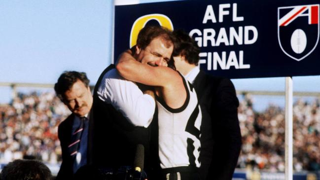 Collingwood coach Leigh Matthews and captain Tony Shaw embrace after the 1990 Grand Final.