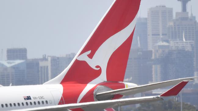 Qantas aircraft are seen at Sydney Airport, Thursday, 24 December 2020. Authorities are urgently investigating how a Qantas crew member contracted Covid-19 after arriving in Darwin from Paris and then flying to Sydney without being tested or quarantined. Federal health authorities are working with Qantas to understand how the man, who landed in Darwin on 17 December after working on a repatriation flight from Paris, became infected. Picture - Sam Mooy/The Australian Newspaper