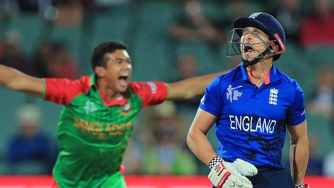 England batsman James Taylor reacts after he was dismissed by Bangladesh bowler Taskin Ahmed, left, during their Cricket World Cup Pool A match in Adelaide, Australia, Monday, March 9, 2015. (AP Photo/James Elsby)