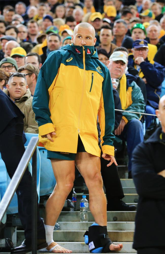 Matt Giteau looks on from the sidelines after sustaining a syndesmosis injury against the All Blacks.