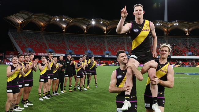 Riewoldt is cheered on by his teammates as he chaired off Metricon Stadium after game 300. Picture: Michael Klein