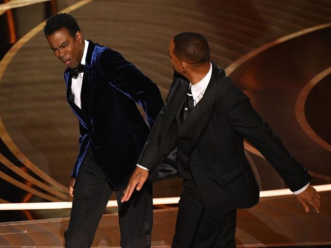 (FILES) In this file photo taken on March 27, 2022 US actor Will Smith (R) slaps US actor Chris Rock onstage during the 94th Oscars at the Dolby Theatre in Hollywood, California. - Will Smith has tendered his resignation from the body that awards the Oscars after his attack on Chris Rock during the weekend ceremony, a statement said April 1, 2022. (Photo by Robyn Beck / AFP)