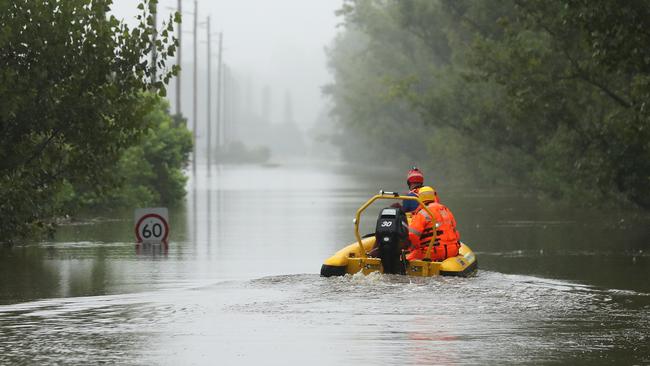 State Emergency Service workers drive their rescue craft through the flooded Hawkesbury River along Inalls Lane in Richmond. Picture: Getty Images