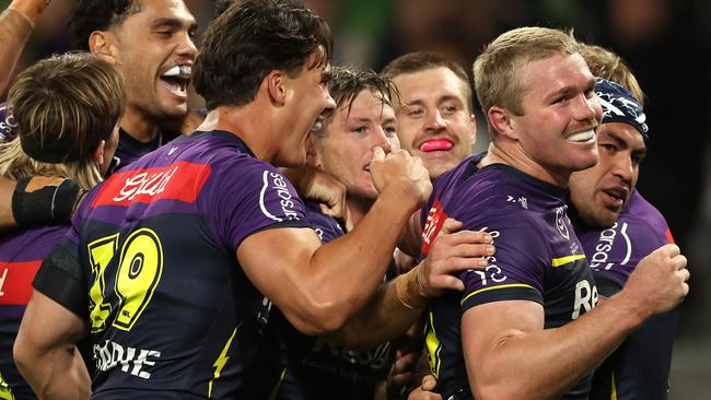 Jahrome Hughes celebrates with teammates after scoring a try. Picture: Robert Cianflone/Getty Images