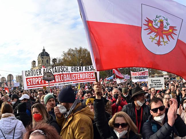 Demonstrators wave the flag of the Austrian state of Tyrol against the measures taken to kerb coronavirus. Picture: AFP