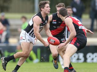 Steven Summerton (Port Adelaide) handballs during the second quarter. West Adelaide v Port Adelaide. SANFL Football, at Richmond Oval. 09/07/16 Picture: Stephen Laffer