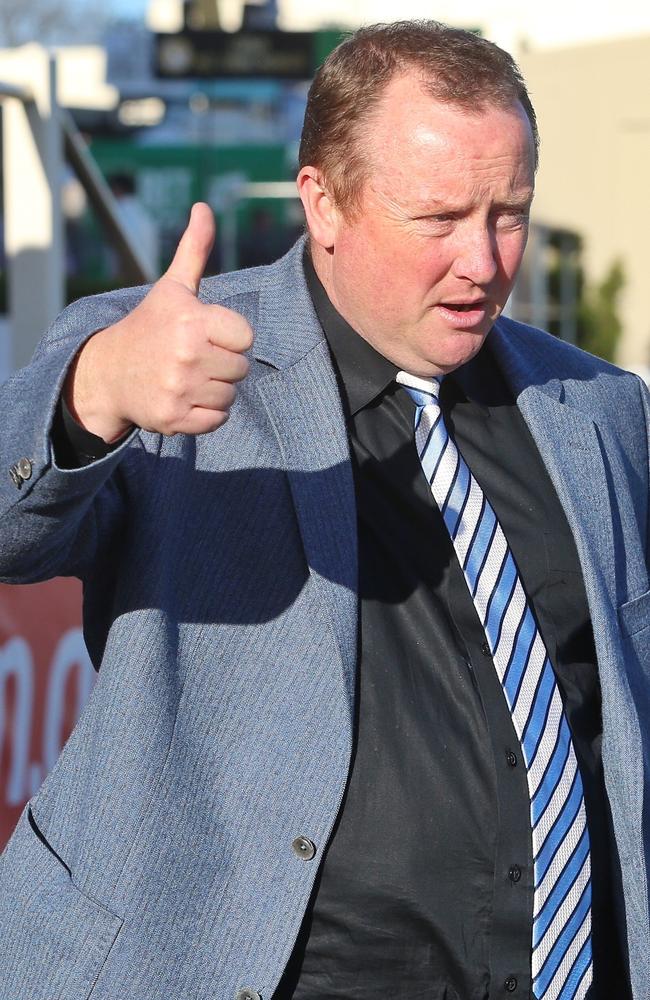 Trainer Wayne Hawkes gives the thumbs up after Star Turn took out the final race on the card. Picture: Hamish Blair