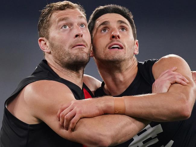 Tom Bellchambers of the Bombers competes for the ball against Mark Pittonet of the Blues (Right) during the Round 4 AFL match between the Essendon Bombers and the Carlton Blues at the MCG in Melbourne, Saturday, June 27, 2020. (AAP Image/Michael Dodge) NO ARCHIVING, EDITORIAL USE ONLY
