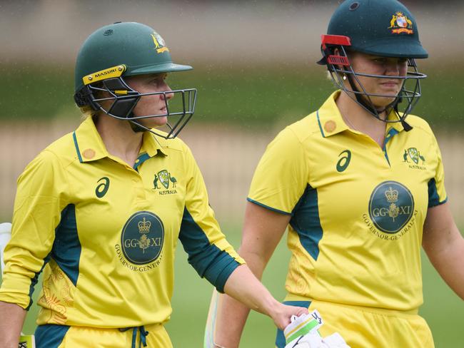 SYDNEY, AUSTRALIA - JANUARY 09: Alyssa Healy of Australia and Georgia Voll of Australia walk from the field as rain delays the match during the One Day match between Governor General's XI and England Women at North Sydney Oval, on January 09, 2025, in Sydney, Australia. (Photo by Brett Hemmings/Getty Images)