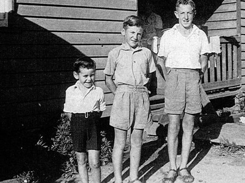 Mike Ryan (left) with his brothers outside the Ryan house on the west side of the Nambucca Station gates. A fettler's house was only modest and the Ryan family of 11 filled every inch with the boys following in their father's footsteps as railway workers. Picture: Nambucca Heads Station Rail Centenary 1923 - 2023 Facebook page