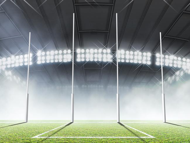 An aussie rules football stadium with a marked green grass pitch and goal posts in the nighttime under illuminated floodlights - 3D render