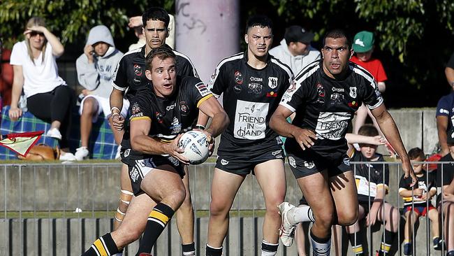 Matraville's Kurtis Preece throws a dummy. Picture: John Appleyard