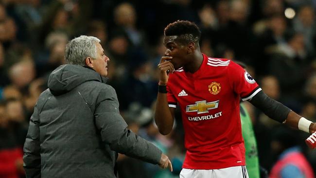 Manchester United's Portuguese manager Jose Mourinho (L) talks with Paul Pogba (R)