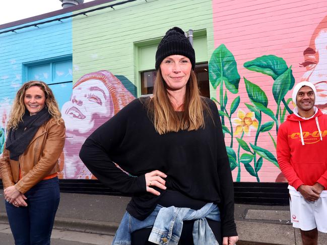 Geelong West has been splashed with an injection of colour and three emotive faces, thanks to a huge 10 metre mural, on the wall of Bakers Delight, Geelong WestÃs Pakington Street. The mural brings an uplifting sense of happiness and joy to our community and importantly honours survivors and sufferers fighting brain and breast cancer. Left: Belinda White (Studio Director, Bells Fine Art), artist Kirstin Walsh and Bakers Delight Geelong West owner Suranga Sena (who survived a rare brain condition).  picture: Glenn Ferguson