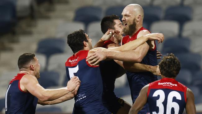 The Demons celebrate after their last-gasp win over Geelong. Picture: Daniel Pockett/Getty Images