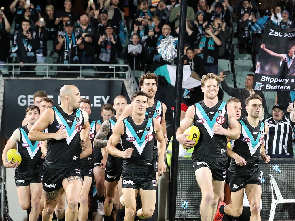 Port Adelaide running onto Adelaide Oval.