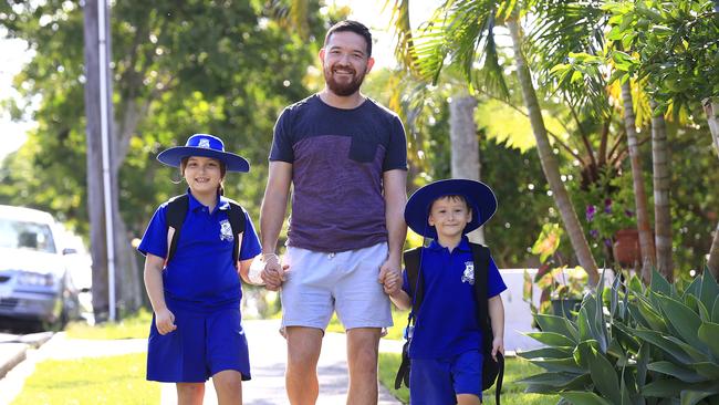 Otto Fischer picks up his chidlren Felix and Quinn from Dutton Park State School. Picture: Adam Head