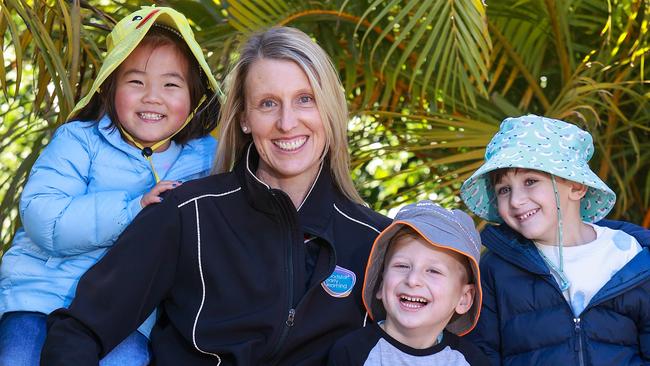 Melina Liu, 4, educator Sonia McLeod, Adam Farah, 4, and Roman Zahr, 4, at Goodstart Early Learning Carlton. Picture: Justin Lloyd