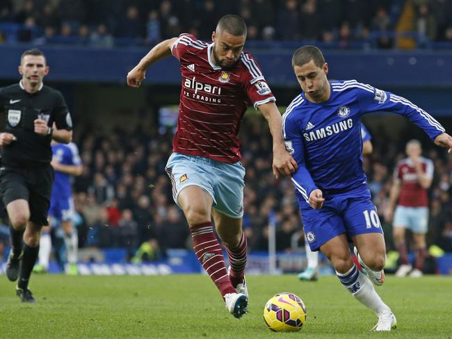 Winston Reid tries to come to grips with Eden Hazard.