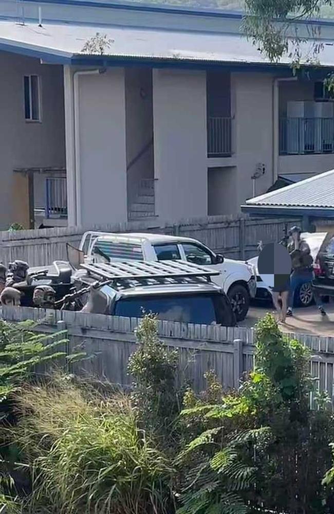 A second woman surrenders to armed Townsville Police officers after a raid at an address in Nix Street in the West End on Friday afternoon. Picture: Supplied