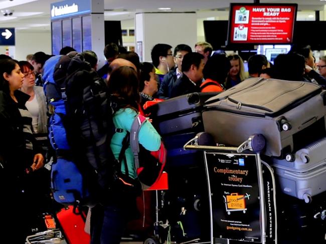 People at the Sydney international Airport during a strike by customs officers could cause some delays in boarding international flights today. Some long cues seen at some check ins but the departures gate was clear .pic John Grainger