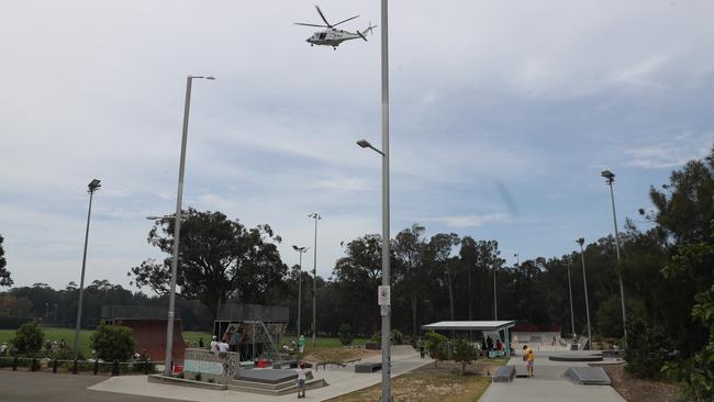 The Ambulance helicopter lifts off over the Mona Vale Skate Park. Picture John Grainger