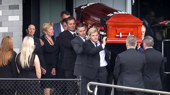 Jackson Warne carries his father’s casket after a private funeral on Sunday. Picture: David Caird