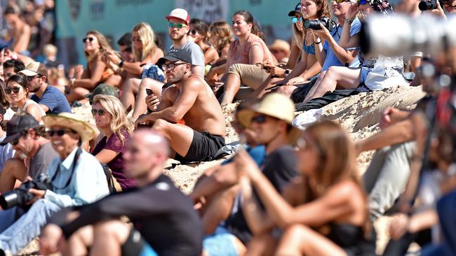 Spectators line the beach to watch surfing legend Kelly Slater compete in his Round 3 heat of the Vissla Sydney Surf Pro at Manly Beach. Picture: Troy Snook