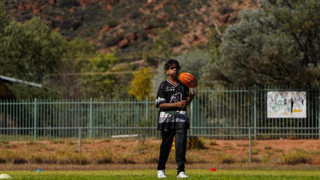 Melbourne Demons players Shane McAdam and Andy Moniz-Wakefield went to Santa Teresa ahead of the 2025 AFL game in Alice Springs. Picture: Melbourne Demons