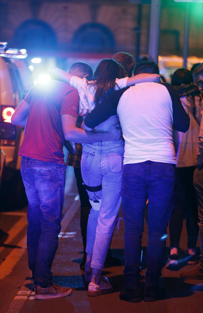 Concertgoers are seen near the Manchester Arena after reports of an explosion. Picture: Joel Goodman/LNP
